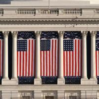 Flags hung against building