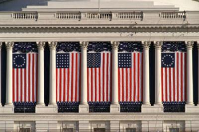 Flags hung against building