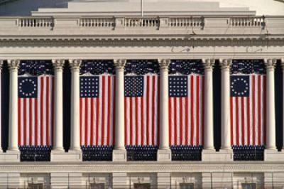 Flags hung against building